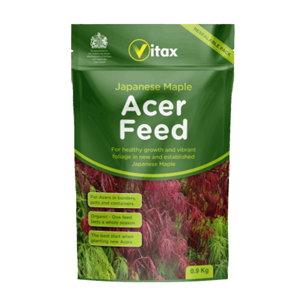 Acer Feed - 900g, perfect for Japanese Maple, is packaged to enhance healthy growth and vibrant foliage. It features eye-catching green packaging decorated with beautiful images of red and green leaves.