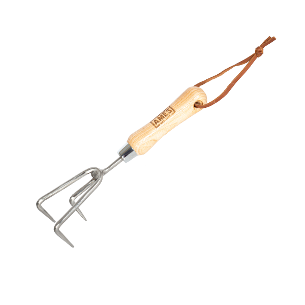 The Hand 3 Prong Cultivator - Stainless Steel features a robust design with a stainless steel build, an FSC® certified ash wood handle, and three metal tines. It includes a convenient leather hanging loop and excels in aerating soil, making it both durable and environmentally friendly.